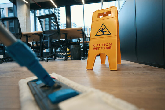 Cleaning with special mop in the modern office - Powered by Adobe