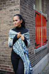 a woman with a natural dyed Javanese batik scarf