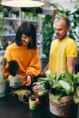 Woman and man work in florist shop.