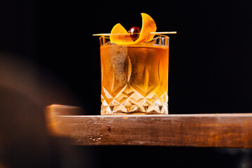 old fashioned cocktail classic bourbon whiskey and bitters, orange peel and cherry as garnish