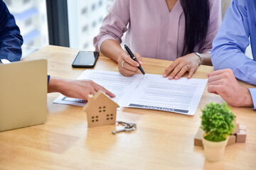 People signature contract on document  for buy house and investment