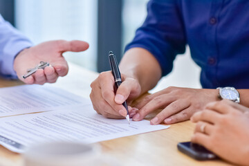 People signature contract on document  for buy house and investment