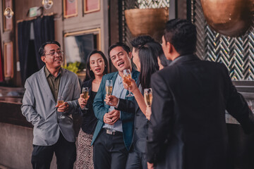 Asian people group drinking in party congratulation business team ,Group Of Friends Enjoying Evening Drinks In Bar - obrazy, fototapety, plakaty