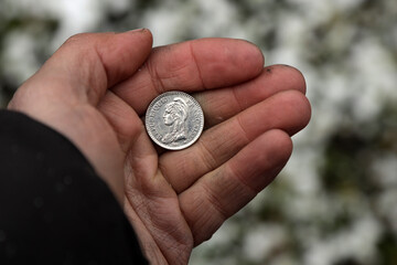 French coin one franc in hand