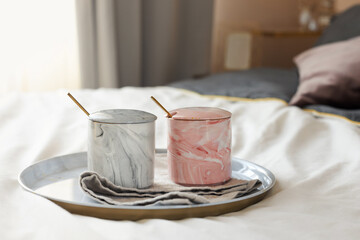 Romantic morning with two cups of coffee in bed on valentine's day