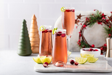 Christmas mimosa with cranberry juice and lime