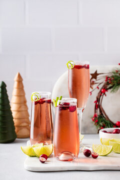 Christmas mimosa with cranberry juice and lime