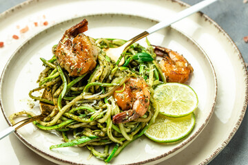 zucchini spaghetti with shrimp. Vegetarian vegetable low carb pasta, Restaurant menu, dieting, cookbook recipe top view