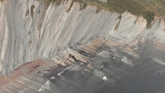 drone flysch sea stack rock lines formation beach stones 