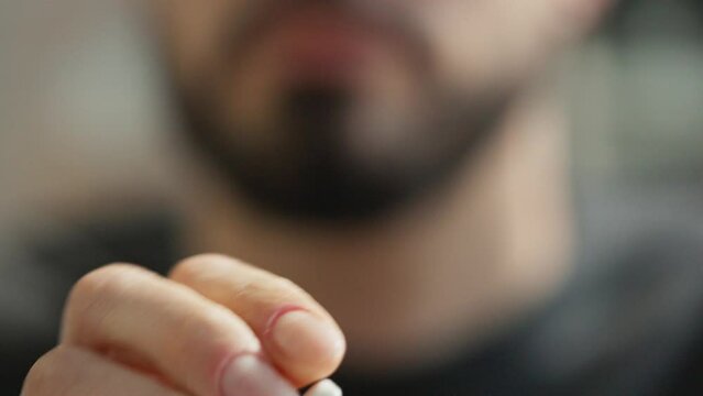Man Using Nicotine Gum To Quit Smoking