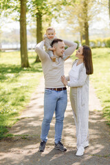 Family Enjoying Walk In Park