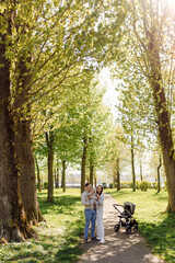 Fototapeta premium Family Enjoying Walk In Park