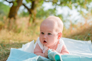 Funny little kid relaxing on the beach outdoors in summer