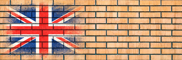 Flag of Britain. Flag painted on a brick wall. Brick background. Copy space. Textured background