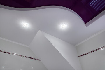Detail of corner ceiling with intricate stucco work. Suspended ceiling and drywall with halogen...