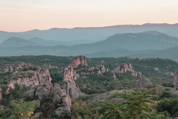 Stunning nature with high rocks and hills in Belogradchik in Bulgaria. Green nature and rocks in the wild with outstanding views.