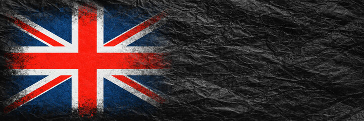Fototapeta premium Flag of Britain. Flag is painted on black crumpled paper. Paper background. Copy space. Textured background