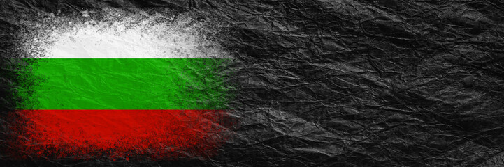 Flag of Bulgaria. Flag is painted on black crumpled paper. Paper background. Copy space. Textured background