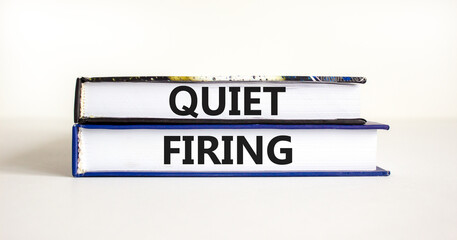 Quiet firing symbol. Concept words Quiet firing on books. Beautiful white table white background. Business and quiet firing concept. Copy space.