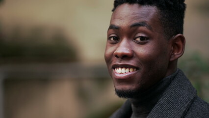 Friendly happy black African man portrait close-up smiling