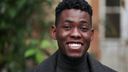 Friendly happy black African man portrait close-up smiling