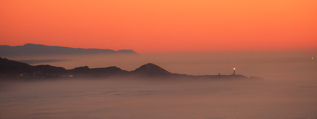 Fog surrounds the Yaquina Head Light, also known early in its existence as the Cape Foulweather...