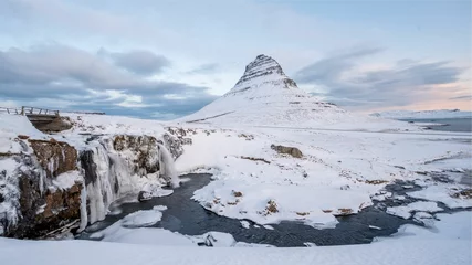 Wall murals Kirkjufell Scenic view of the Kirkjufell mountain covered by snow located in Iceland
