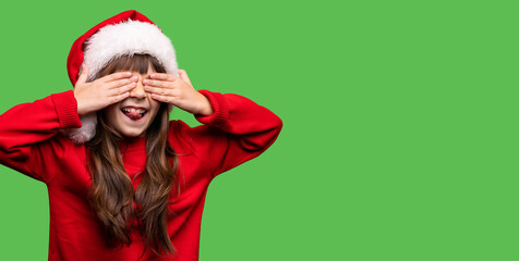 Happy xmas and New Year. Portrait of child funny girl in Santa red hat waiting for Christmas gifts. Smiling funny kid with closed eyes with hands in anticipation of miracle