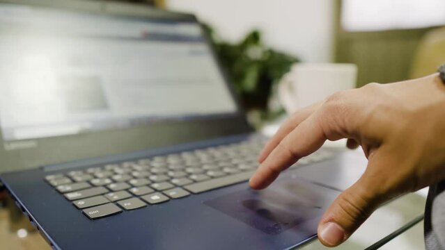 Man checks on website what to buy for special dates with his credit card while having a cup of coffee.
