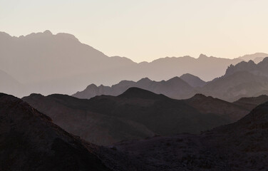 Dramatic layered mountains of Sinai in the evening. View from Dahab. Dahab, Sinai peninsula, Egypt