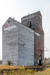 Three red and white grain eleavotrs and trains. Waseca, Saskatchewan, Canada