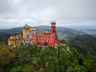 Aerial drone view of Park and National Palace of Pena in Sintra, Portugal during a magical day....