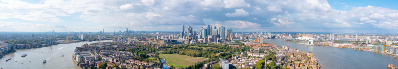 London panorama, the city on the river bank, with residential buildings, green areas, and modern...