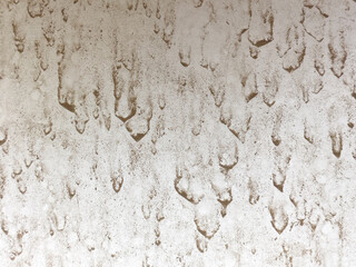 Mud splatters on white hood of car background texture, close up, detail. Dried mud from rain drops of dirt of light color on white surface, need washing concept