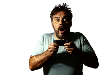 Man holding video game controller and expressing surprise while playing video game. Transparent background