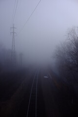 railroad and power lines in the fog