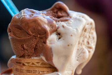 Delicious italian chocolate and hazelnut ice cream balls cone in summer Otranto Italy