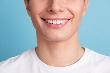 Smiling man with perfect teeth on color background closeup cropped photo