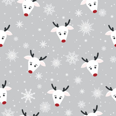 White deer with snowflakes on a gray background. Wrapping paper, winter greetings, web page background, Christmas and New Year greeting cards.