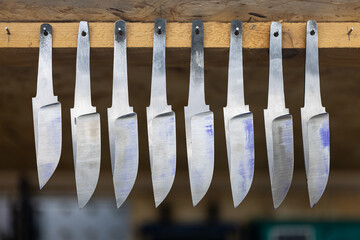 Different Knife blades ready for adding the grips. The concept of individual engineering production, cutlery.