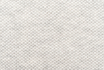 White natural texture of knitted wool textile material background. White crochet cotton fabric...