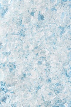 Close up crushed ice in sunlight. Summer pattern background refreshment concept