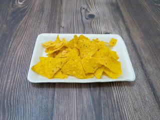 Crispy chips made from corn and other ingredients with a savory taste