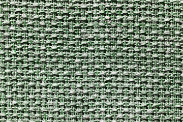Green fabric texture. Closeup textile background. Apparel clothes. Casual wear. Knit pattern. Warm winter fiber material. Cotton background. Plain cloth background.