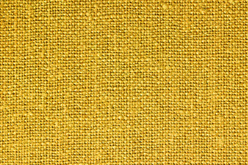 Yellow fabric texture. Closeup textile background. Apparel clothes. Casual wear. Knit pattern. Warm...