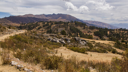 Fototapeta na wymiar Dry andean landscape, with large mountains Cusco, Peru