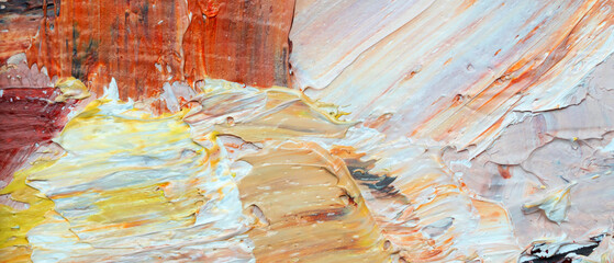 Macro. Abstract art. Expressive embossed pasty oil paints and reliefs. Colors: yellow, white, ocher.