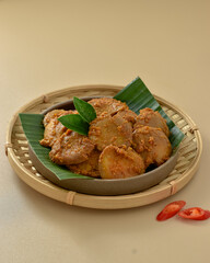 Rendang Jengkol, dogfruit simmered in spices and coconut milk. Indonesian traditional comfort food, with a spicy savory taste typical of rendang and a legit jengkol texture. Served on plate