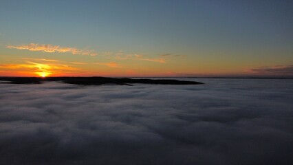 Fototapeta na wymiar Sunset over the clouds