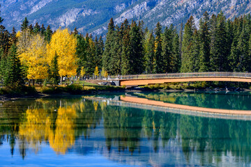 Footbridge and reflection over the Bow River in Banff Town, Banff National Park